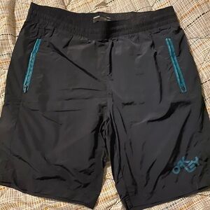 Oakley men’s shorts, size XL, black with blue trim.